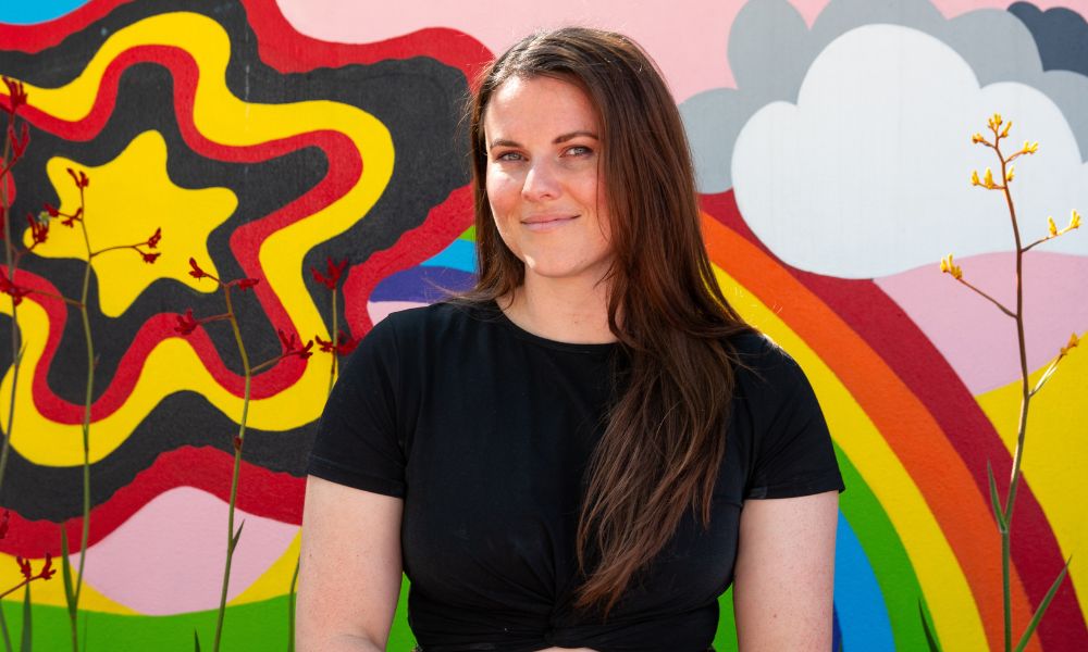 Photo of a teenager on a mural background