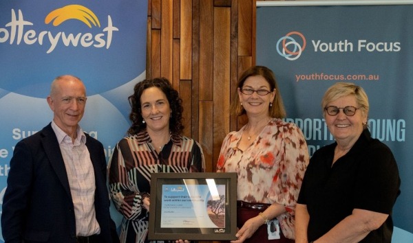 Lotterywest grant to transform Perth's first Youth Mental Health Hub 1 Four people standing in front of Lotterywest and Youth Focus banners